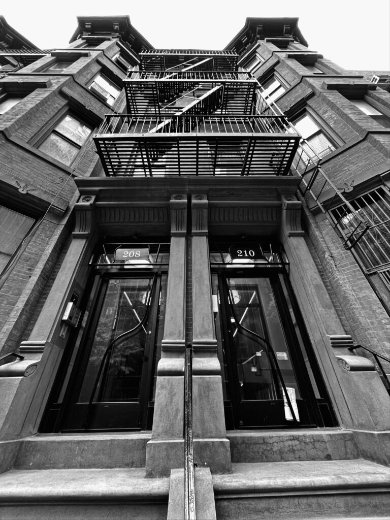 Brick facade and architectural detail on Bed-Stuy brownstone
